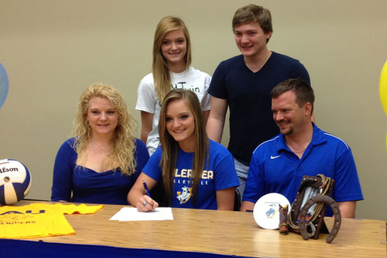 Hannah Rice, flanked by her parents Connie and Willie Rice, and her twin sister McKenzie and brother Aaron, signs her letter of intent with SAU.