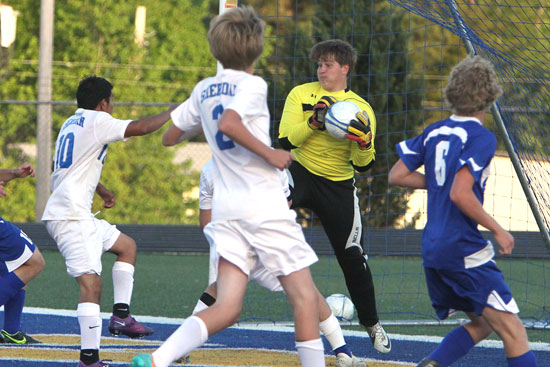 Bryant keeper Alex Denker secures the ball to thwart a Sheridan bid to score. (Photo by Rick Nation)