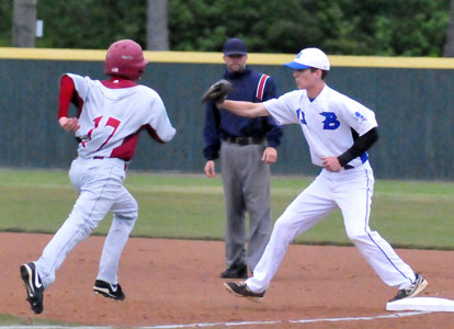 Ty Harris takes a throw at first to retire Texarkana's Steven Boyce (17). (Photo by Kevin Nagle)