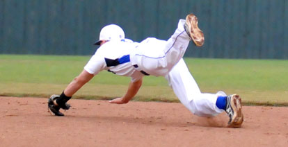 Korey Thompson saves a run with a diving stop in the second inning of Bryant's win over Texarkana. (Photo by Kevin Nagle)