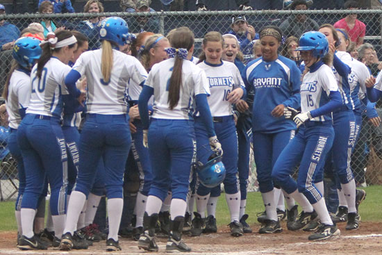 The Lady Hornets greet freshman Sierra Jones (15) after her first home run ever. (Photo by Rick Nation)