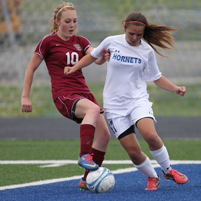 Bryant's Hailey Levinson battles with a Texarkana player for possession. (Photo by Rick Nation)