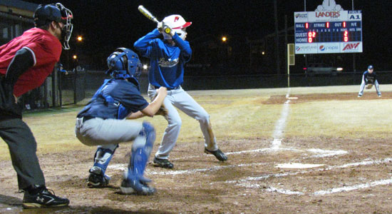 Tristen Hammonds gets ready to take a cut in front of Eat My Catfish catcher Ryan Lessenberry. (Photo courtesy of Lara James)