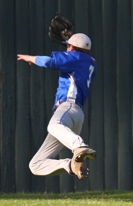 Tyler Green makes a lunging catch in front of the center field wall. (Photo by Rick Nation)