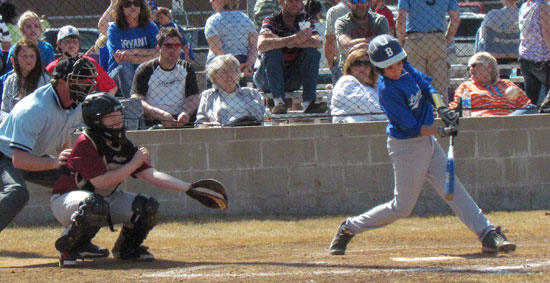 Logan Catton drives a single to center in front of State Farm catcher Austin Trimble. (Photo courtesy of Lara James)