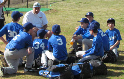 Dodgers coach Michael Catton meets with his team after Saturday's win. (Photo courtesy of Lara James)