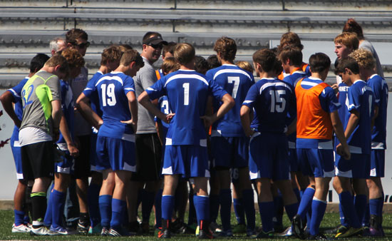 Bryant head coach Jason Hay talks with his team during a break in Saturday's action. (PHoto by Rick Nation)