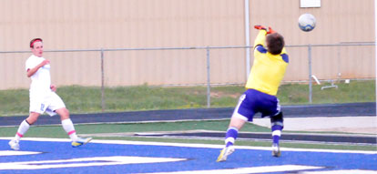 Bryce Denker, left, gets a shot past the El Dorado keeper. (Phtoto by Kevin Nagle)