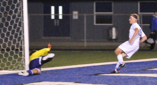 Blake Reed, right, follows through on a goal. (Photo by Kevin Nagle)