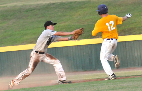 Bryant first baseman Bailey Bowers applies a tag on Ashdown's Drew Akins in the third inning of Wednesday's game. (Photo by Kevin Nagle)