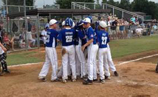 The Bryant 12-year-old All-Stars greet Cade Dupree after he belted a home run in Sunday's Regional Tournament game. (Photo by Madison McEntire)