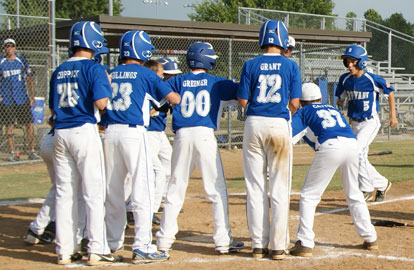 Cade Dupree is greeted at home plate by his teammates after his grand slam on Monday. (Photo courtesy of Diane Dupree)
