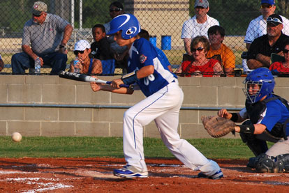 Coby Greiner gets a bunt down.