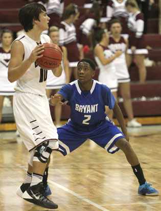 Bryant's Desmond Duckworth (2) defends against Benton's Cason Maertens. (Photo by Rick Nation)