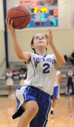 Kelly Williams drives in for a layup after making a steal during the second quarter of Monday's game. (Photo by Kevin Nagle)