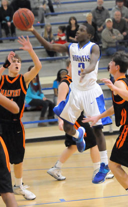 Calvin Allen (3) finishes off a drive with a finger-roll for 2 of his 7 points in Monday's game. (PHoto by Kevin Nagle)
