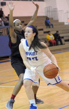 Rachel Barber tries to drive around a Pine Bluff defender. (Photo by Kevin Nagle)