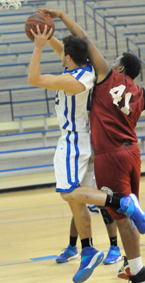 Clay Ingold is fouled by Texarkana's Demetrius Taylor. (PHoto by Kevin Nagle)