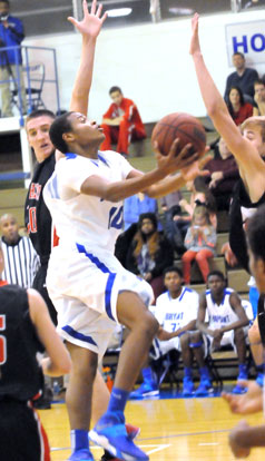 Bryant's Rickey Buchanan tries to get a shot away in the teeth of the Cabot defense. (Photo by Kevin Nagle)