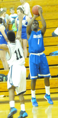 Greyson Giles (1) launches a 3 from the corner over Little Rock Fair's Jarrett Cole. (photo by Kevin Nagle)