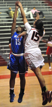 Jayla Anderson is fouled by Pine Bluff's Jasmyn Eckerman. (Photo by Kevin Nagle)