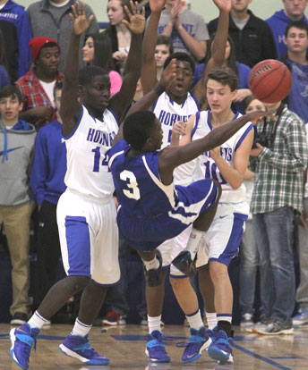 Caylin Allen (14), Brandon Harris and Garrett Cowart (10) team up defensively. (Photo by Rick Nation)