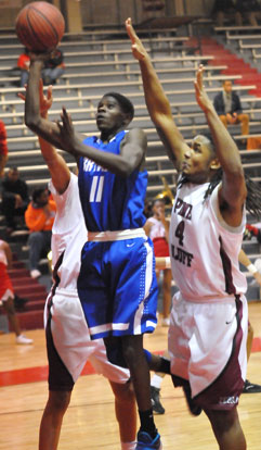 Kevin Hunt (11) gets between a pair of Pine Bluff defenders including Will Gragg (4). (Photo by Kevin Nagle)