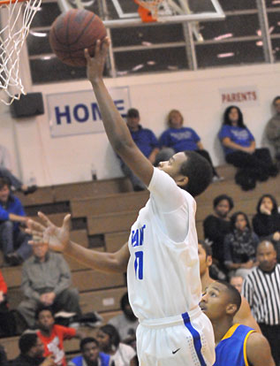 Rickey Buchanan scores inside for the Hornets. (Photo by Kevin Nagle)