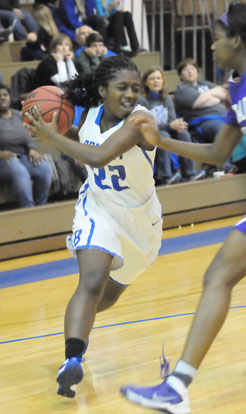 Taylor Hill drives to the basket. (Photo by Kevin Nagle)