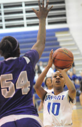 Jakeria Otey looks for room to shoot over El Dorado's 6-3 Taylor McCool. (Photo by Kevin Nagle)