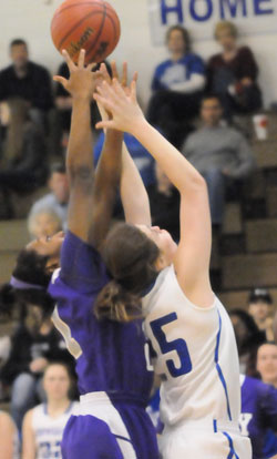 Bryant's Erica Smith (25) battles for a rebound. (Photo by Kevin Nagle)