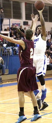 Bryant's C.J. Rainey pulls up for a jumper in front of Lake Hamilton's Corey Worley. (Photo by Rick Nation)