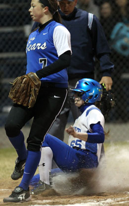 Bre Sanders slides in safely. (Photo by Rick Nation)