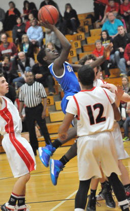 Calvin Allen goes to the hole on his way to 2 of his 18 points in the game. (Photo by Kevin Nagle)