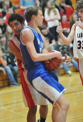 Bryant's Landon Kays is tied up by Cabot South's Seth Hankerson. (Photo by Kevin Nagle)