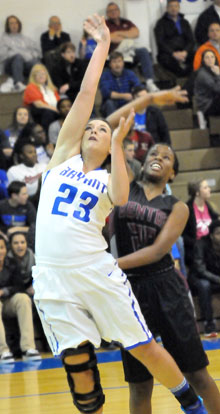 Aubree Allen (23) puts up a shot inside of Benton's Tia Brazelle. (Photo by Kevin Nagle)