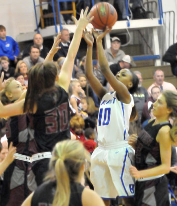 Jakeria Otey (10) fires up a shot in a crowd on her way to 29 points in Wednesday's game. (Photo by Kevin Nagle)