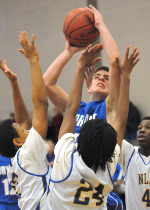 Brooks Ellis raises up in a crowd for North Little Rock defenders to get a shot away. (Photo by Kevin Nagle)