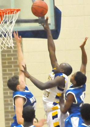 Trey Ashmore, left, and Jonathan Allen try to stop North Little Rock's Larry Hatchett. (Photo by Kevin Nagle)