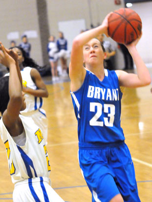 Kendal Rogers winces in anticipation of the physical defense played by North Little Rock as she drives to the basket. (Photo by Kevin Nagle)