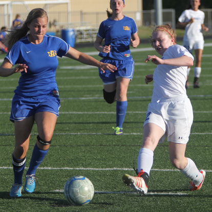 Caroline Campbell, right, maneuvers past a North Little Rock defender. (Photo by Rick Nation)