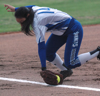 Tori Hernandez makes a back-hand stab down the third-base line. (Photo by Kevin Nagle)