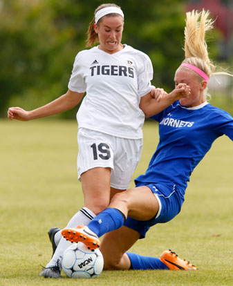 Bryant's Callie Schalk slides the ball from Bentonville's McKenzie Dixon on Saturday, May 24, 2014, in the Class 7A championship game at Razorback Field in Fayetteville. (Photo courtesy of Jason Ivester/NWA Newspapers LLC)