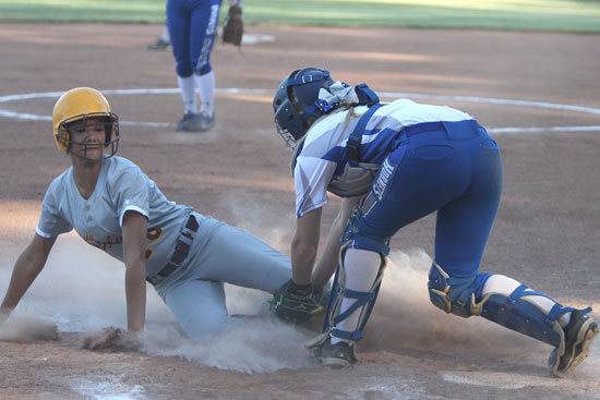 Bryant catcher Julie Ward tags out a Lake Hamilton runner at the plate. (Photo by Rick Nation)