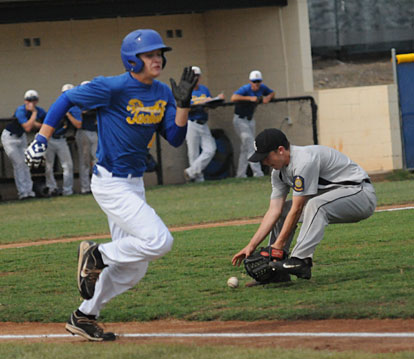 Bryant's first-game starting pitcher Dylan Hurt fields a bunt. (Photo by Kevin Nagle)
