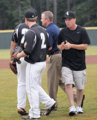 Former Sox coaches Craig, right, and Tic Harrison, middle, threw out the ceremonial first pitch on Wednesday. (Photo by Kevin Nagle)