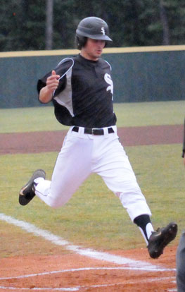 Chase Tucker reaches home plate. (Photo by Kevin Nagle)