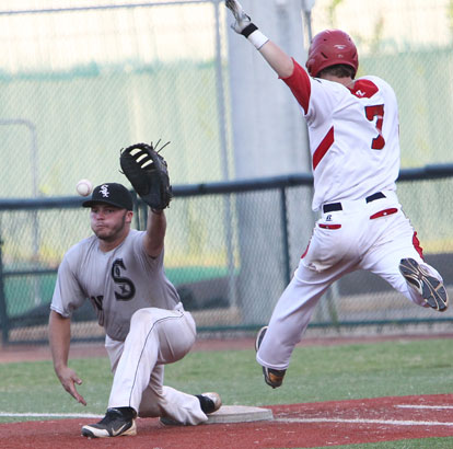 Hayden Lessenberry stretches for a throw at first as Tennessee's Peyton Sockwell stretches to reach base. (Photo by Rick Nation)