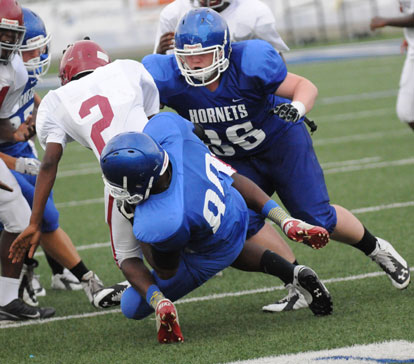 Bryant's Johnny Wallace (80) and Ray Davis (86) bring down Pine Bluff Robey's Kendrick Thorn (2). (Photo by Kevin Nagle)