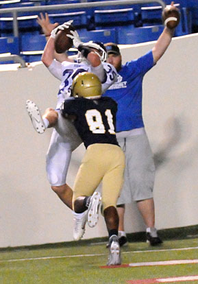 Paul Tierney hauls in a touchdown pass over a Pulaski Academy defender. (Photo by Kevin Nagle)